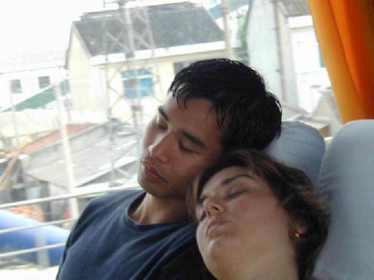 Taking a nap on a tour bus in China.