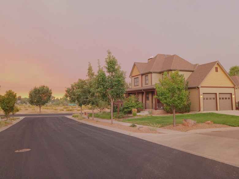 The sky was so dark at 2:00 p.m. that my neighbors' outdoor lights automatically turned on!