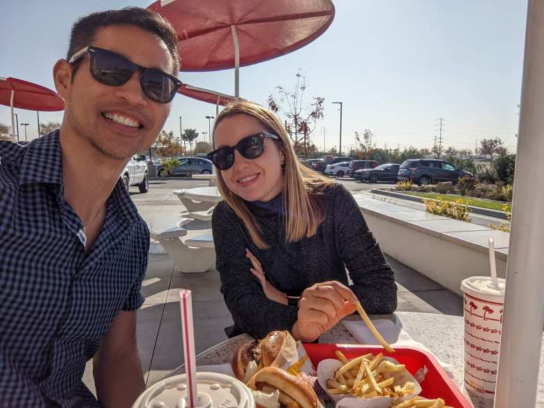 Felix and andrea enjoying cheeseburger and fries at In-n-Out.