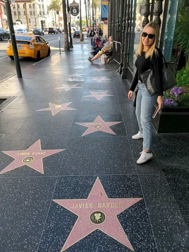 Andrea between the Javier Bardem and Penelope Cruz stars on the Walk of Fame.