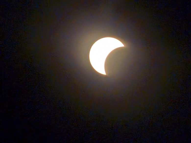 The sun being partially eclipsed by the moon during the total solar eclipse of April 8, 2024.