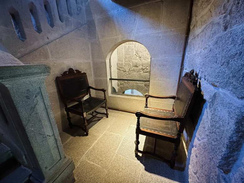 These wooden chairs in a sitting area next to a stairway were some of the only furniture still in the Castle of Soutomaior.