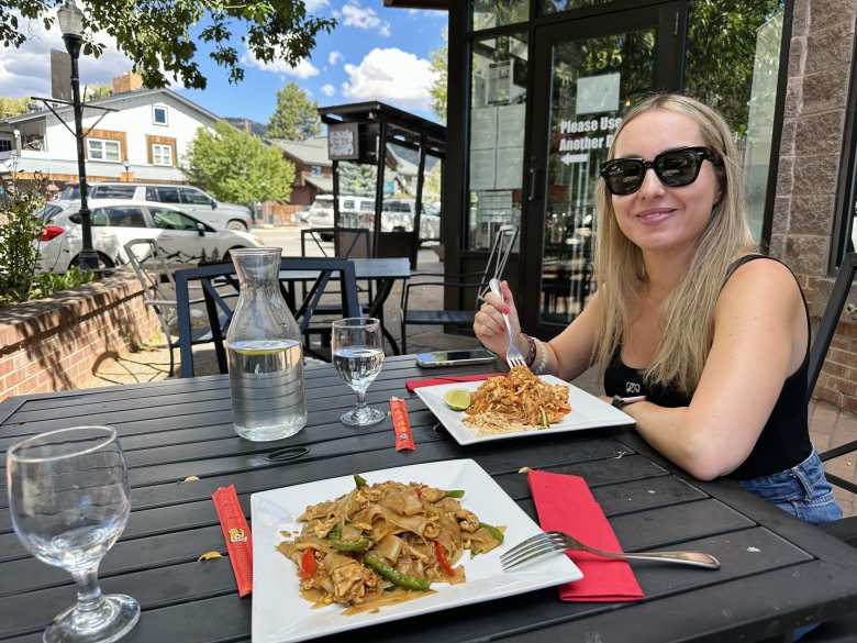 Andrea with a plate of Pad Thai at Mai Thai Steamboat Springs.
