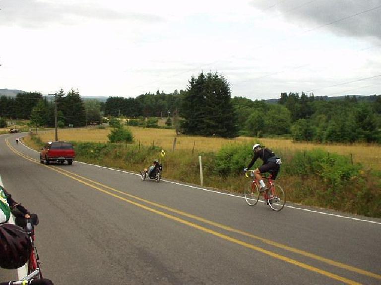 [Day 2, Mile 134, 8:05 a.m.] On the way stop, here's a cyclist behind a guy on a racing trike.  Not much frontal area to draft off of, as you can see!