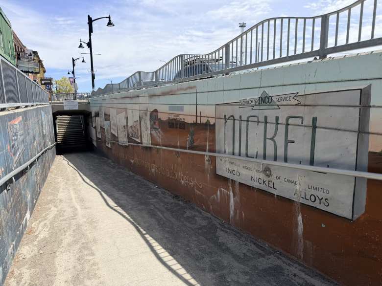 Murals on the walls of a pedestrian underpass in downtown Sudbury.