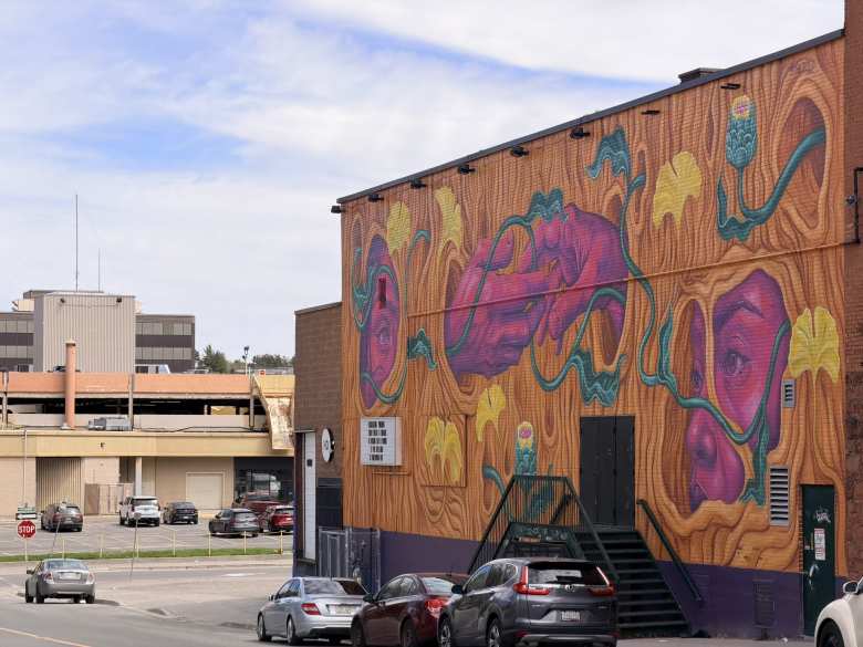 A mural of hands, trees, and flowers in downtown Sudbury. A mural of hands, trees, and flowers in downtown Sudbury.
