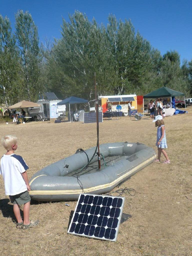 A raft with a solar-powered spigot was popular with the kids, many of whom jumped in.
