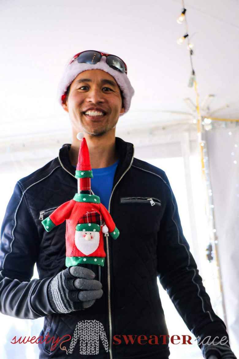 Sweaty Sweater awards were bottles of Robertson South African wines dressed in Christmas outfits. Felix Wong came in third in age group.