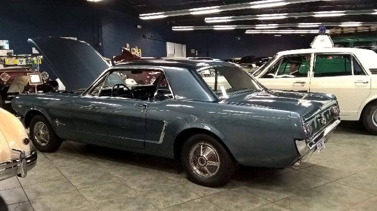 This blue-grey 1965 Ford Mustang and 1968 Ford Zephyr police car to the right of it were converted to all wheel drive by Fergusen Research.