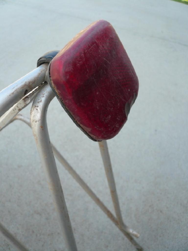 On bumpy trails, my tent bag would press this taillight into the rear tire until I attached the mounting bracket to the top of the rack instead of the bottom.