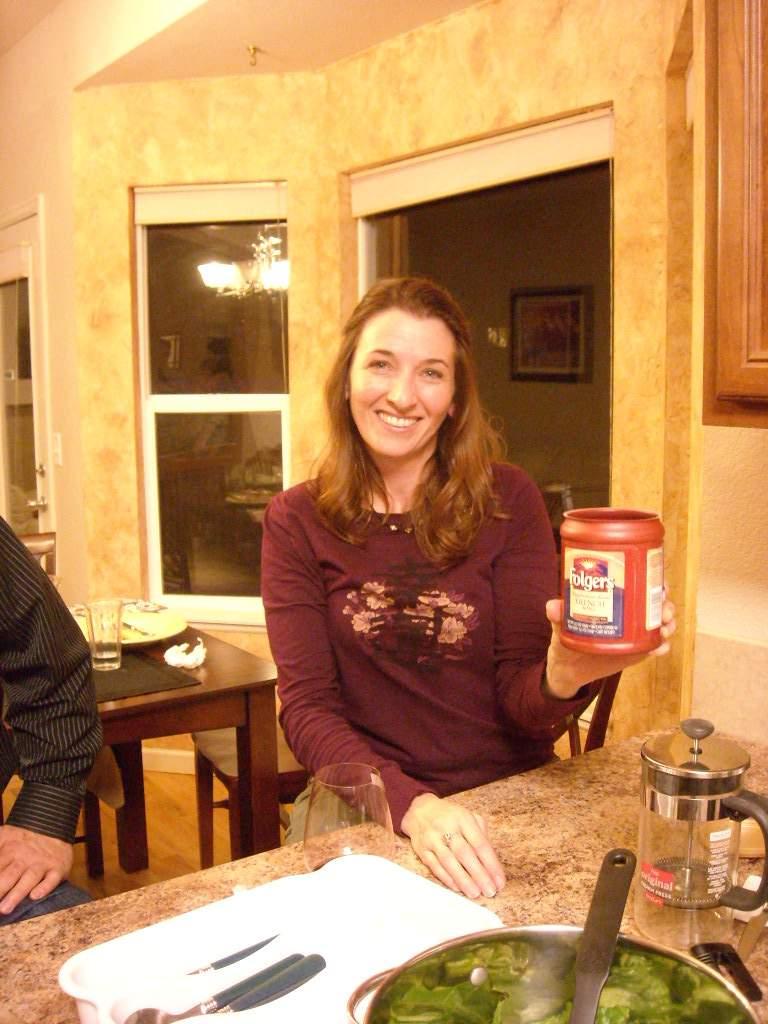 Tori holding a can of Folger's coffee from my cupboard that apparently expired last year.  She had lots of "Felix Wong food stories" for us.