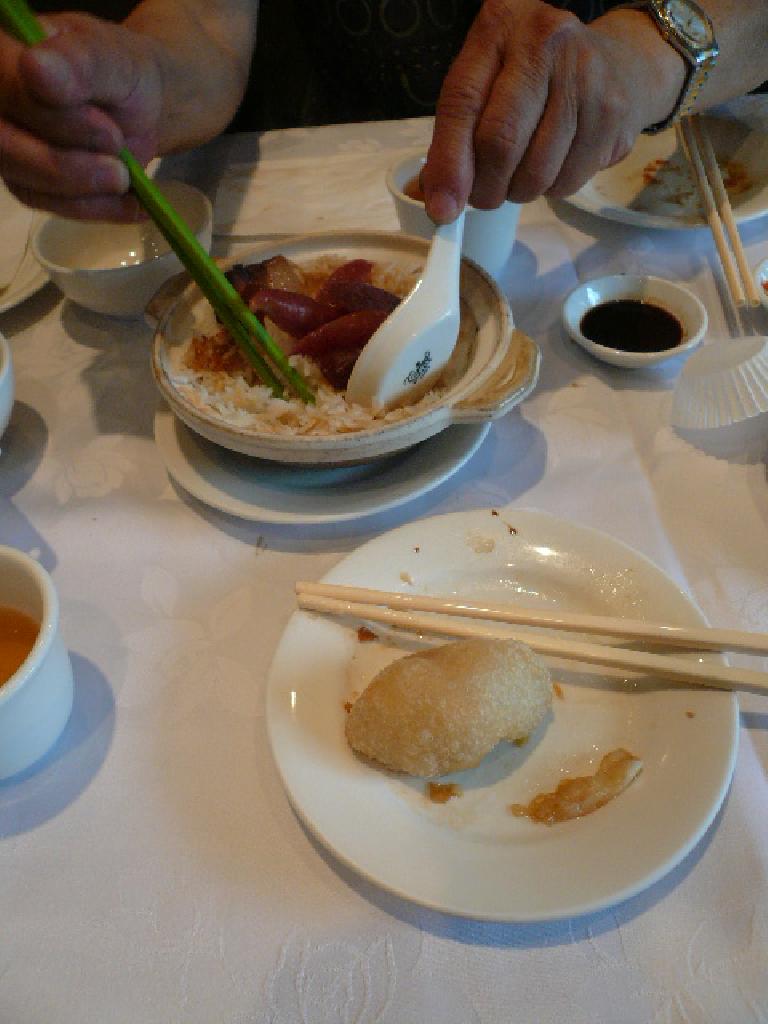 Some of the food we ate included chinese sausage over rice and sesame dumplings.