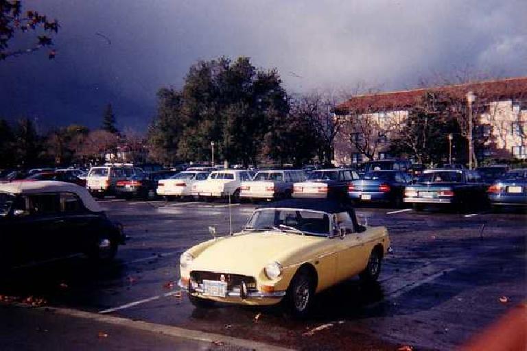 [January 1996] Goldie in the Stanford parking lot, a couple of months after I bought her.  Note the 1970 grille.  In half-a-year, I'd replace it with an early style, chrome ribbed one.