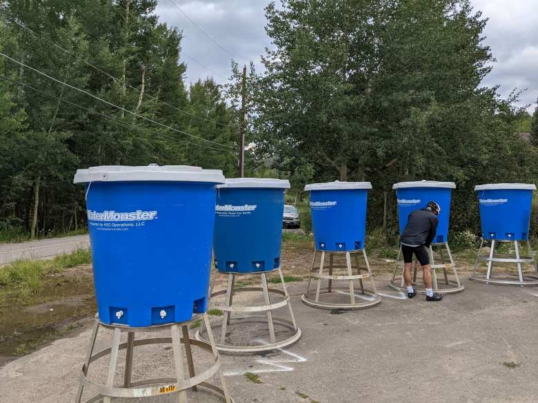 These blue WaterMonster hydration dispensers provided an efficient way for cyclists to refill their bottles with water.