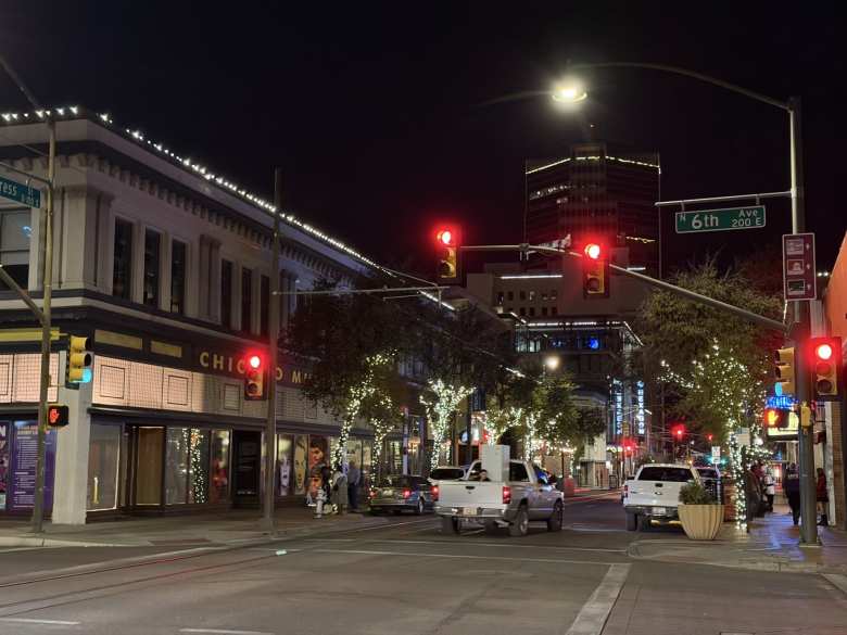 Evening scene on Sixth and Congress Street in downtown Tucson. Arizona does not have a law that bans riding in the pickup truck bed, although it can be very dangerous.