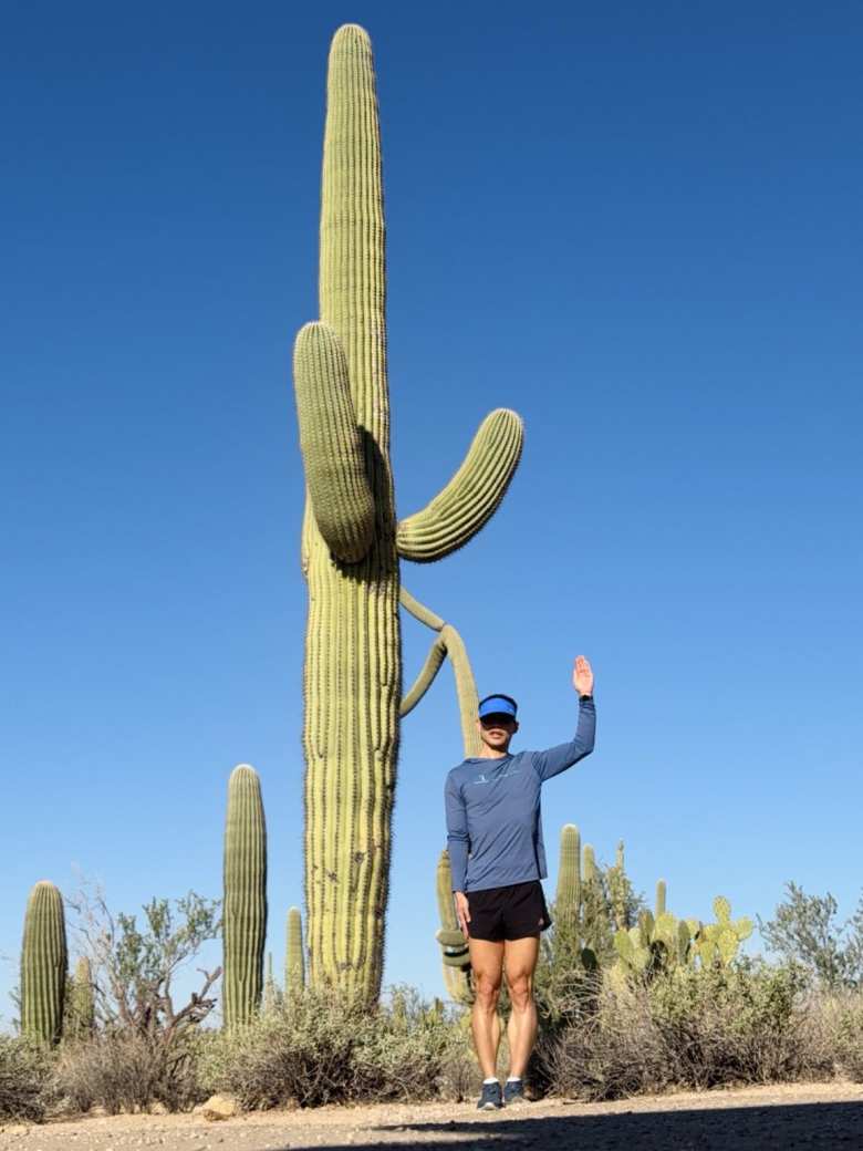 Posing with a Saguaro cactus.