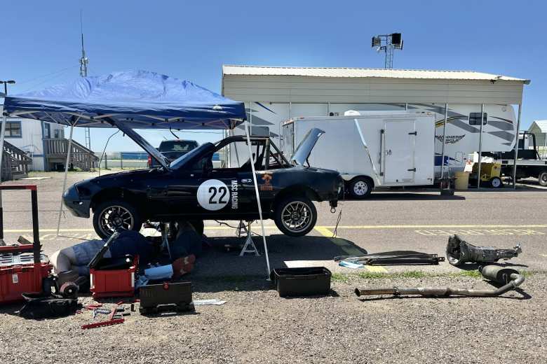 I was amazed at how the team was able to remove the exhaust, transmission, and eventually, the engine, from underneath the car, without an engine hoist, in the paddock in 94F heat.