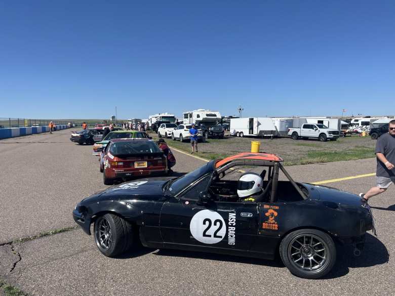 Manuel's team's #22 Miata lined up at the start of Race Session 1. Manuel's team's #22 Miata lined up at the start of Race Session 1.