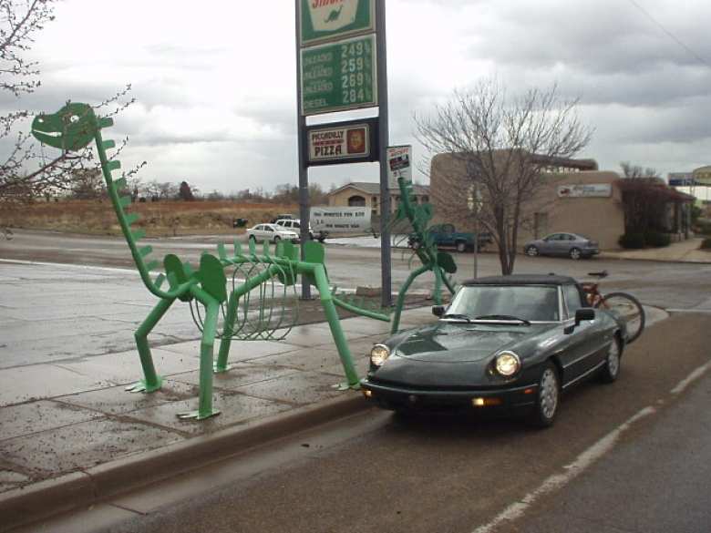 My green 1991 Alfa Romeo Spider Veloce and some dinosaurs in Blanding, where there's even a dinosaur museum.