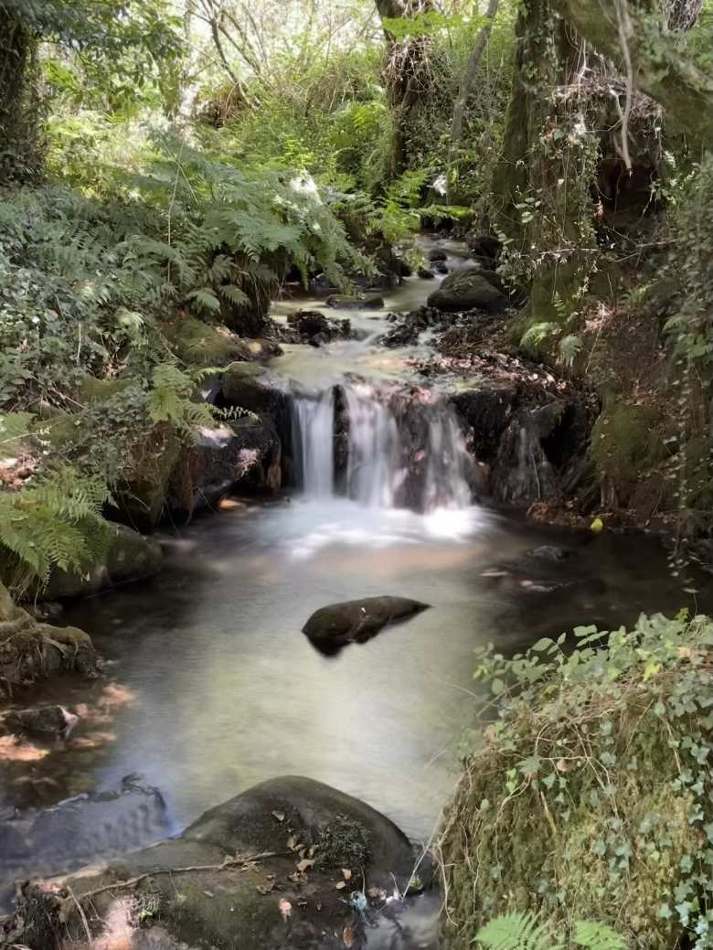 A waterfall at Ruta da Pedra e da Auga.