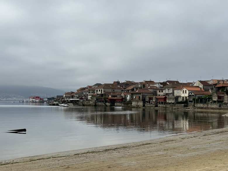 Approaching Combarro, famous for its hórreos (granaries elevated on pillars).