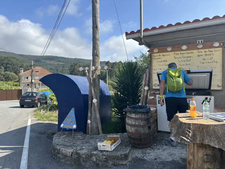 In Poio, there was this setup by a Trail Angel. You could pick up whatever food or drink you wanted and leave some money for them.