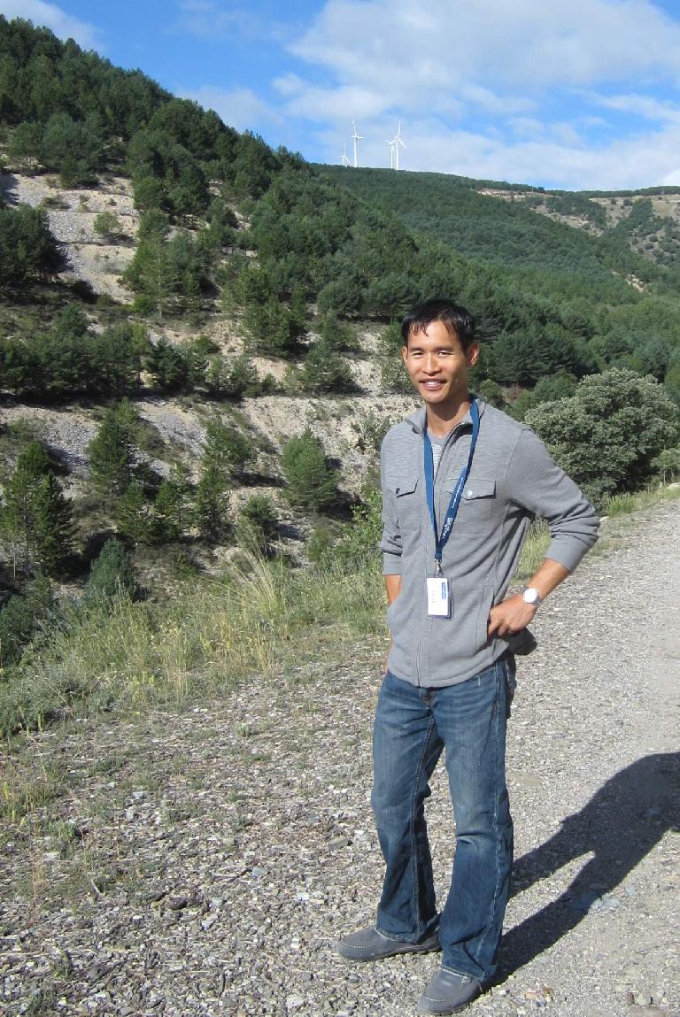 Felix Wong in front of a windmill during a one-to-one talk/walk.