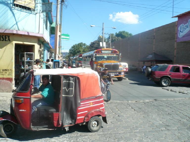 Another tuk-tuk and chicken bus. These were in Chimaltenango. (December 31, 2010) Another tuk-tuk and chicken bus. These were in Chimaltenango. (December 31, 2010)