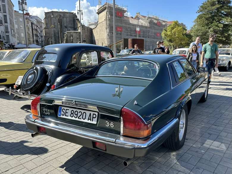 A British Racing Green Jaguar XJ-S coupe.