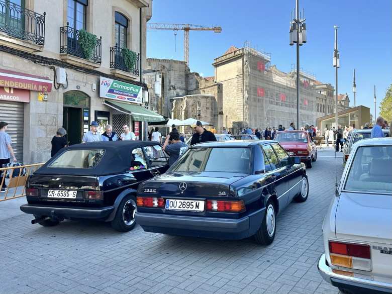 A black Mercedes 190E sedan.