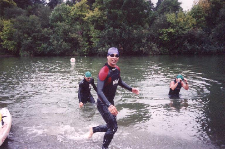 [Swim Mile 2.4, 1:51:xx elapsed] I actually felt good on the swim, though... just slow!  Here I am emerging from the water... the purple swim cap signifies that I was part of the under-40yo wave.