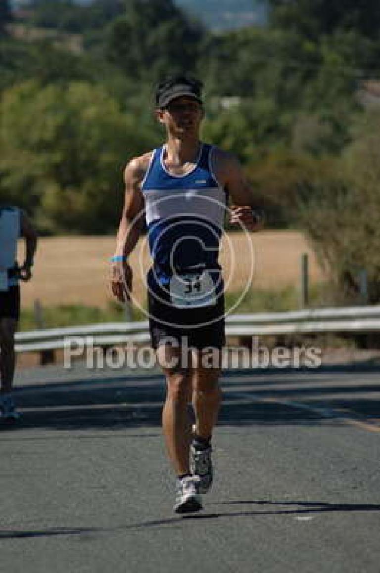 Another photo of myself running, this time cresting one of the several small hills. Photo: PhotoChambers.com. Another photo of myself running, this time cresting one of the several small hills. Photo: PhotoChambers.com.