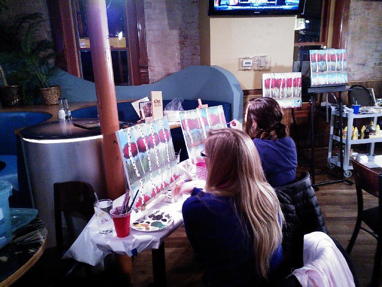 Noelle and Dani with their paintings.