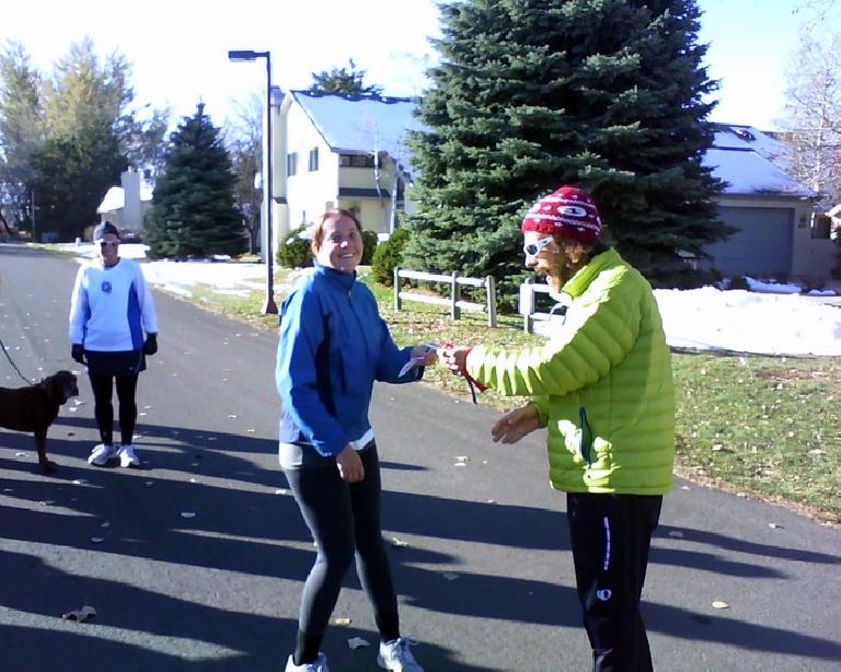 Race director Nick handing Kelly a ribbon for her 3rd place finish.