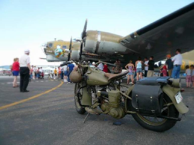 Vintage motorcycle in front of the B-17. Vintage motorcycle in front of the B-17.