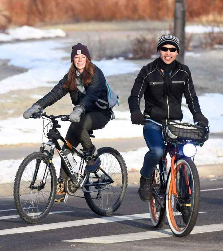 Brooke and Felix riding bicycles during Winter Bike to Work Day.