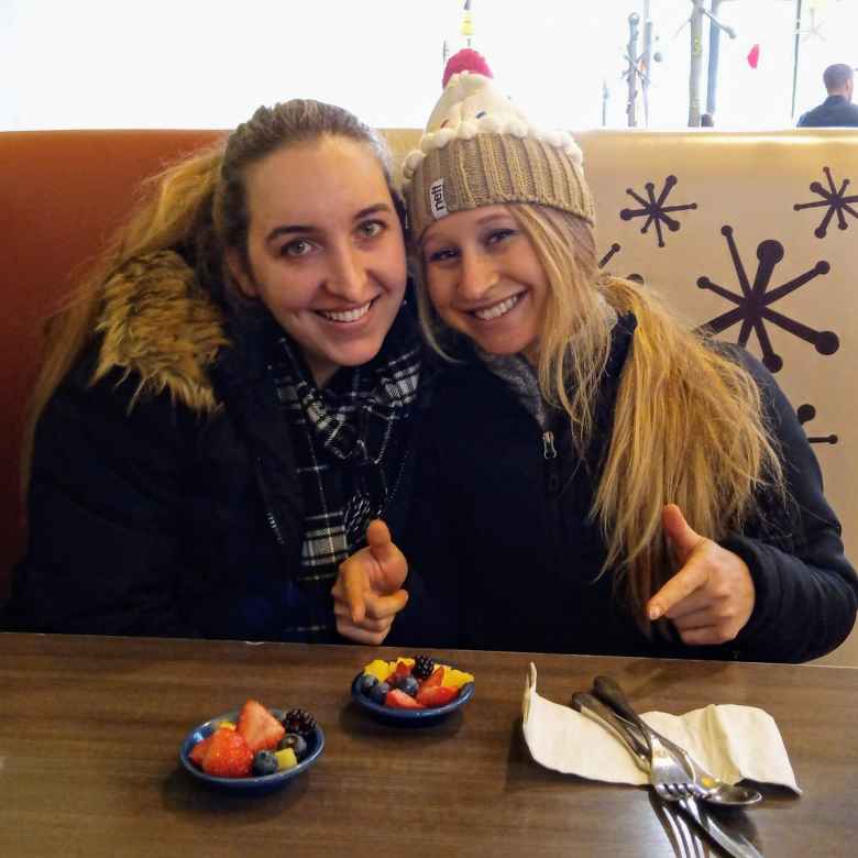 Victoria and Emily with some fruit trays at Snooze.
