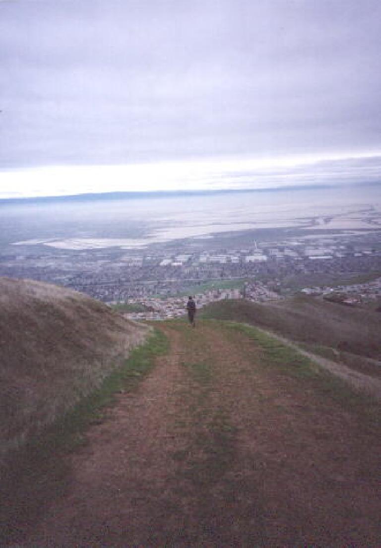 [Monument Peak, Jan 2002] Coming down from the summit with a great view of the Bay Area down below.
