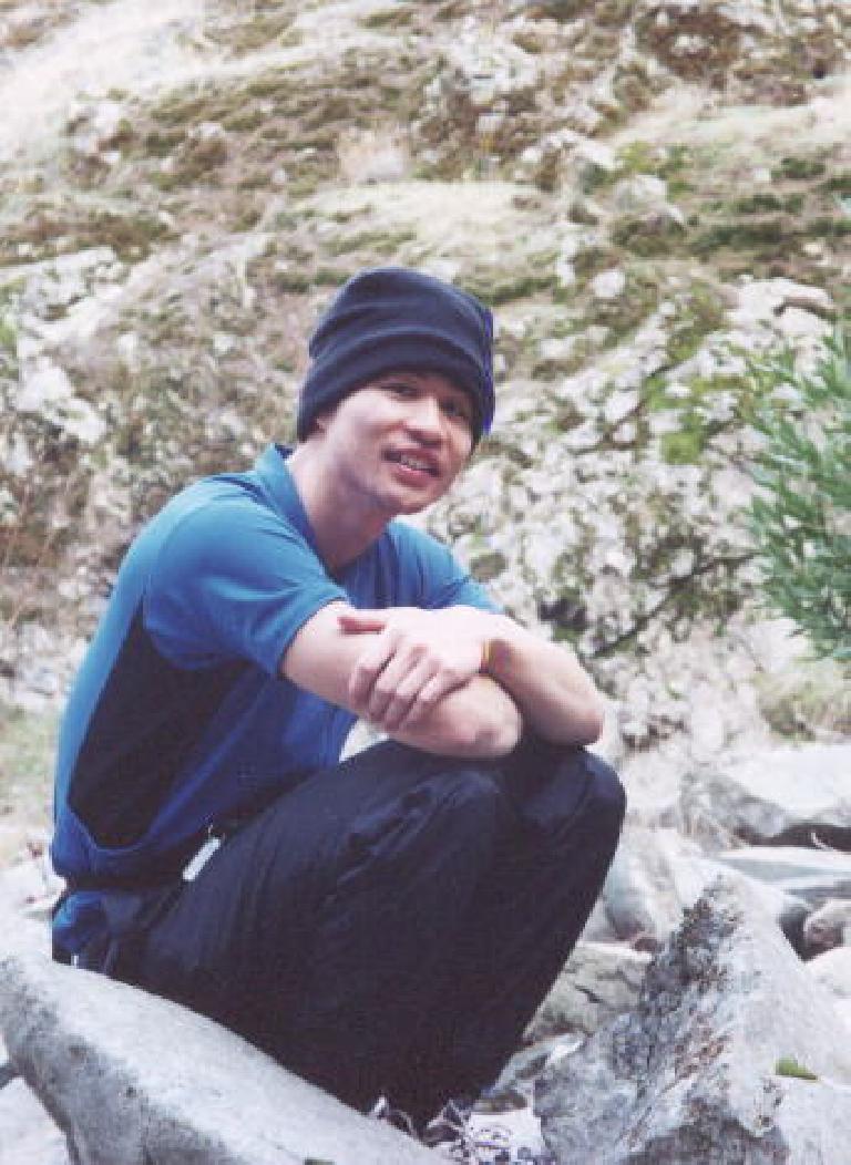 [Ohlone Wilderness Trail, Jan 2002] Felix Wong at lunch, a little damp but happy.