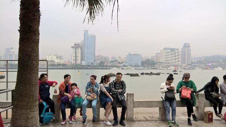 Folks by the harbor of the island of Gulangyu, with Xiamen in the background. (April 20, 2016) Folks by the harbor of the island of Gulangyu, with Xiamen in the background. (April 20, 2016)
