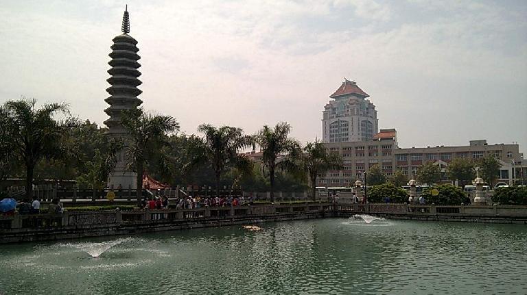 Pagoda and pond in Xiamen, with Xiamen University in the background.