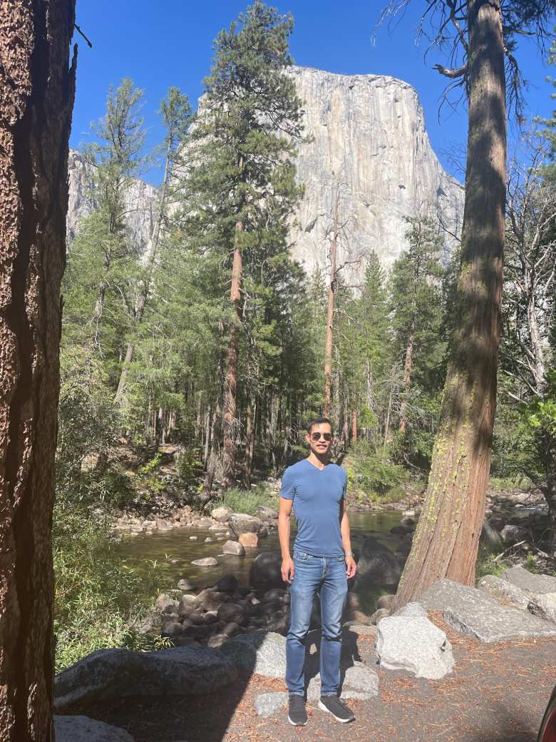 Felix Wong in front of of the Merced River and the south side of El Capitán.
