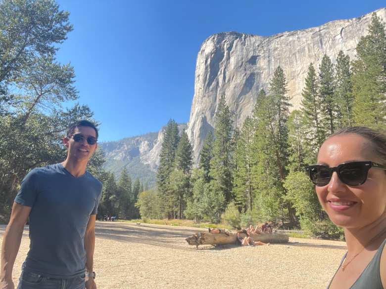 Felix and Andrea at Merced Beach, with the southeast side of El Capitán and its prominent "The Nose" in the background.